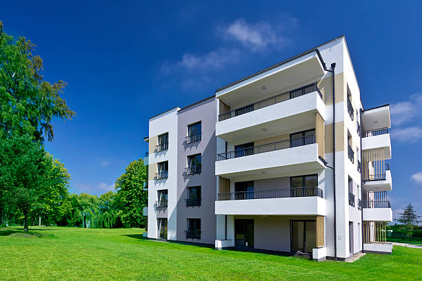 istock Modern apartment house in the park 452623583