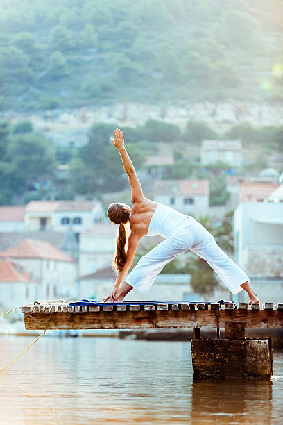 istock Female doing early morning yoga 452627199