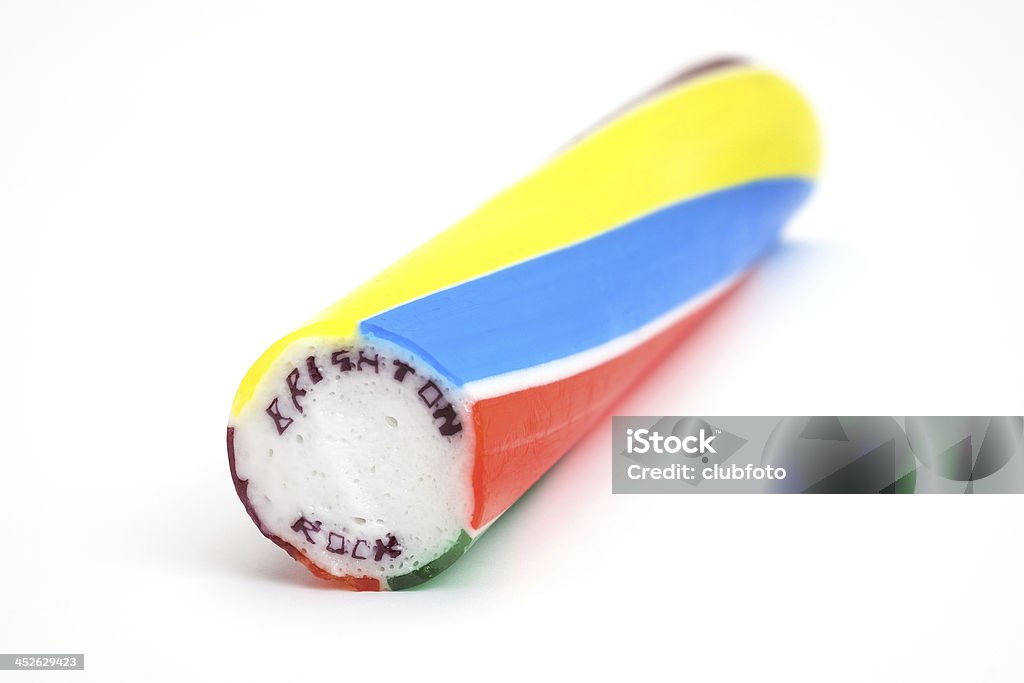Stick of Brighton rock A stick of traditional fruity Brighton rock.   The words Brighton and Rock pass through the whole length of the sweet confectionary. Brighton is of course the name of the popular south coast English seaside town. Stick of Hard Candy Stock Photo