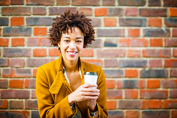 istock Cheerful woman drinking coffee 452630199
