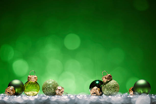 Green Christmas Baubles - Glitter Bokeh Season Holiday Background stock photo
