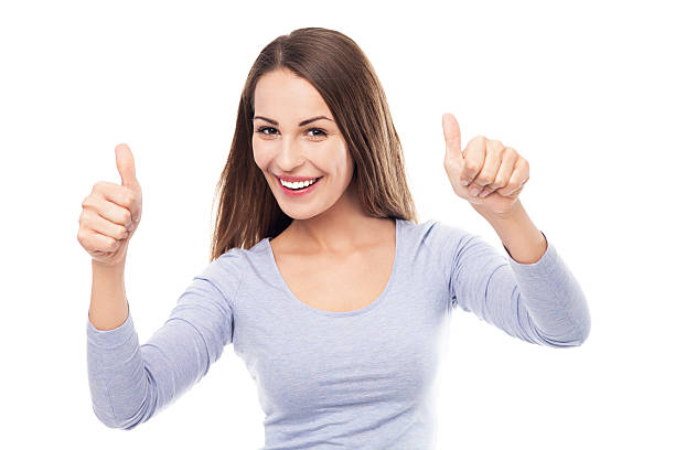 istock Young woman with thumbs up 452632245
