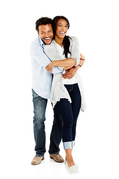 istock Cheerful african couple embracing on white background 452635881