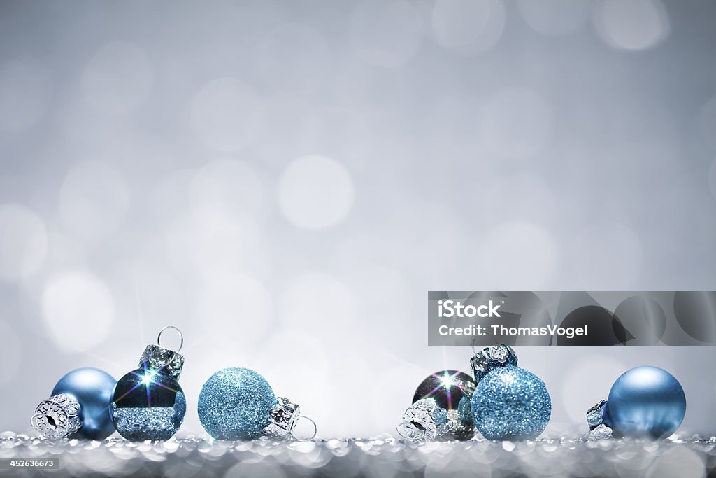 Blue Christmas Baubles - Glitter Bokeh Season Holiday Background Blue Christmas Baubles Blue Stock Photo