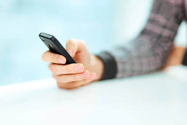 istock male hand typing on smartphone 452655619