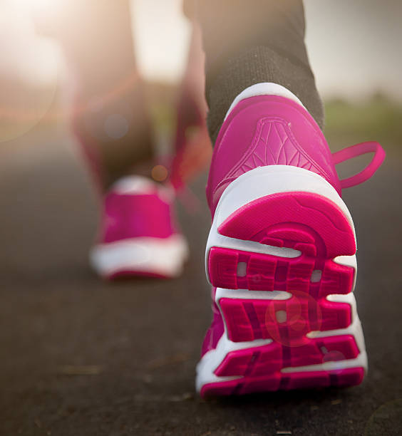 istock Young woman running 452664035