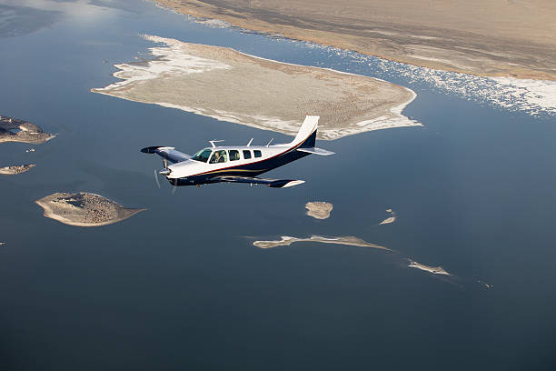 1969 Model 36 Beech Bonanza over Mono Lake CA, shot from another aircraft.