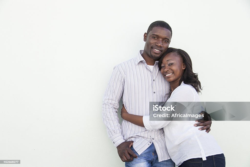 African couple posing, looking at the camera. African couple posing, looking at the camera in Cape Town, South Africa. White Background Stock Photo