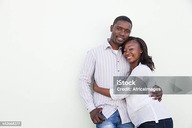 African Couple Posing Looking At The Camera Stock Photo - Download Image Now - White Background, Comfortable, Consoling