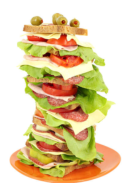 istock tall sandwich with ham salad and cheese on white background 452677105