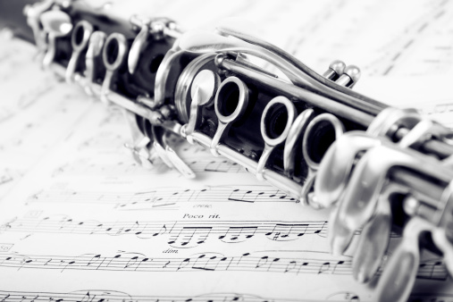 Part of clarinet on sheet music background