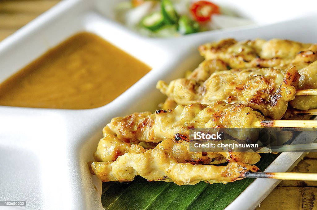 Grilled pork served with peanut sauce Grilled pork served with peanut sauce or sweet and sour sauce( moo satay) Appetizer Stock Photo
