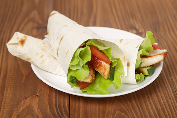 istock wheat tortilla with chicken and vegetables 452685089