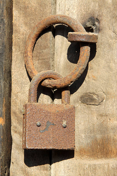 istock rusty lock on the wooden door 452687567