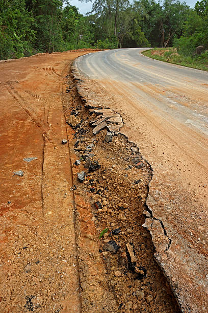 The road begins collapse. The road begins collapse. trafficcrack stock pictures, royalty-free photos & images