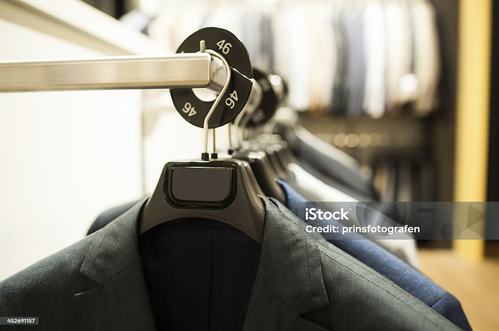 suits suits on hangers Boutique Stock Photo