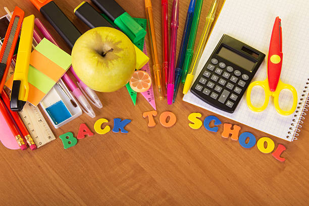istock School accessories on wooden surface 452692889