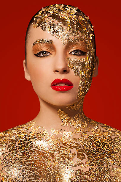 Beautiful Woman with Gold Leaf Beauty Portrait stock photo