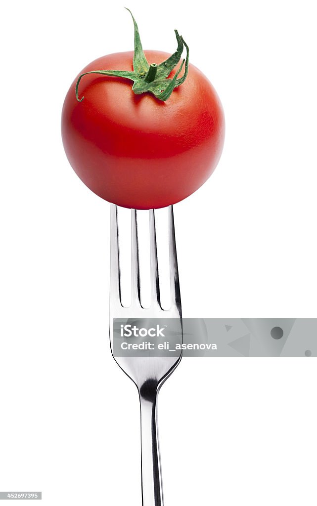 Pomodoro su una forchetta - Foto stock royalty-free di Forchetta