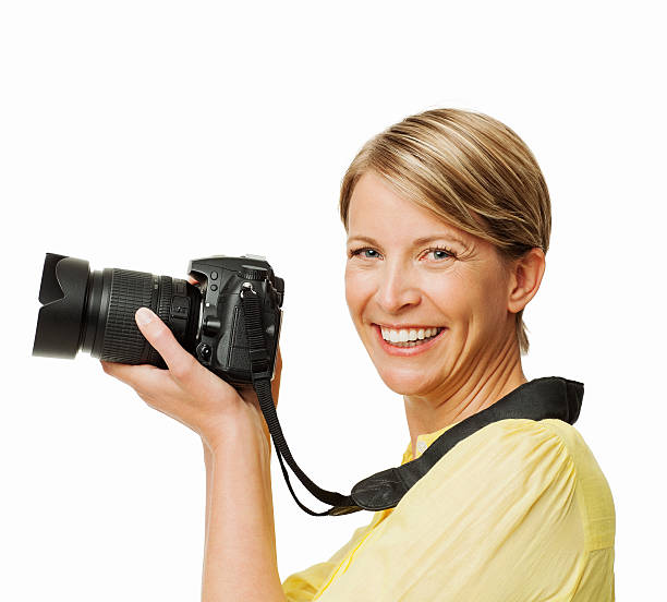istock Happy Woman Holding SLR Camera 452698413