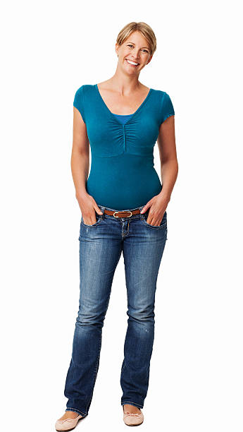 istock Woman With Hands In Pockets Smiling Against White Background 452698423