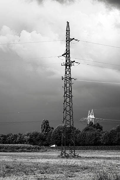 istock Electricity Pylon with Thunderstorm. Black and White 452699773