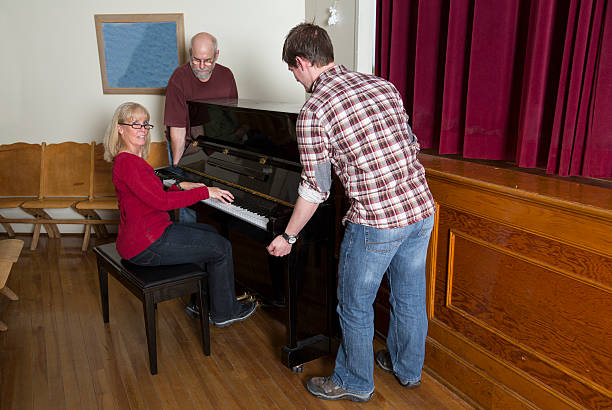 istock Stop the music. Moving piano with mucician. 452699981