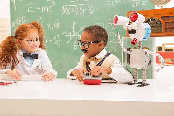 istock Education:  Retro revival children making robot in science lab. 452700189