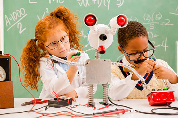 istock Education:  Retro revival children making robot in science lab. 452700201