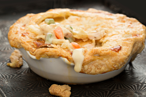 A high angle close up who of a freshly baked individual turkey pot pie.