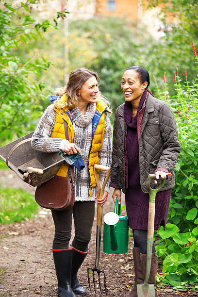 istock Two young women smiling in the garden 452701529