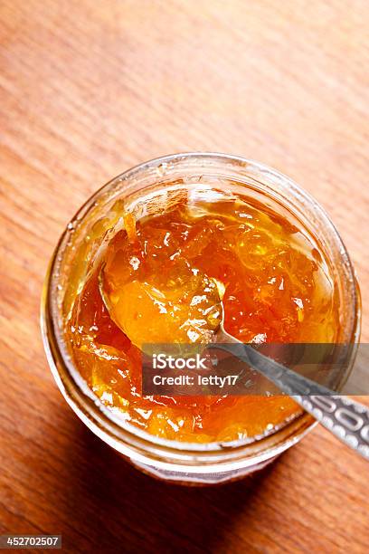 Orange Jam Stock Photo - Download Image Now - Marmalade, Spoon, Brown Background