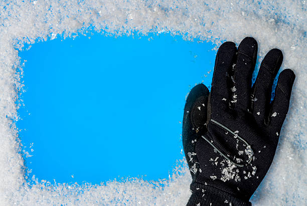 istock winter glove and snowflake 452702975