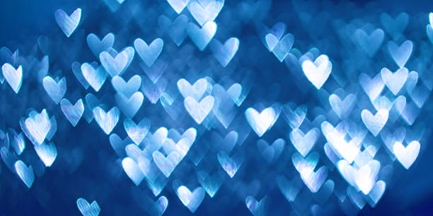 istock Blue bokeh of hearts background 452702977