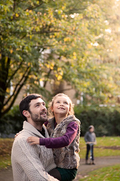 istock Father and daughter in the park 452703653