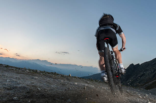 istock mountainbiker on the limit to keep his mountain trail 452705207