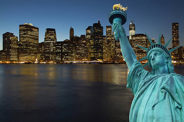 istock Lower Manhattan at night with Statue of LIberty 452711181