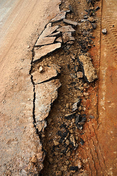 The road begins collapse. The road begins collapse. trafficcrack stock pictures, royalty-free photos & images