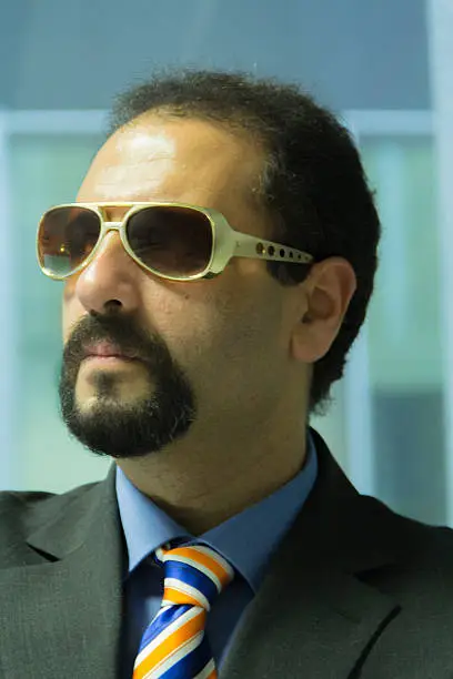 An arab business man with retro sunglasses