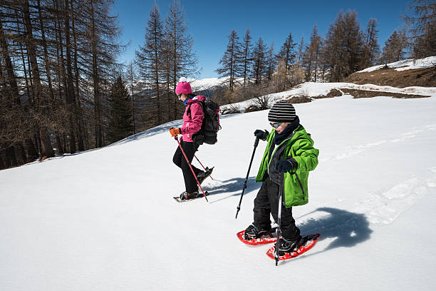 istock Mother and Son Snowshoeing 452719419