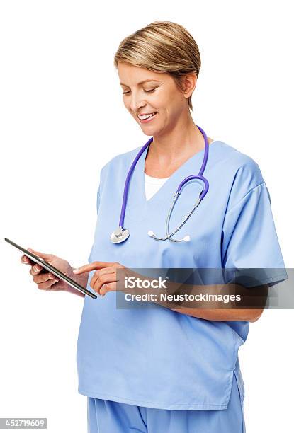 Nurse With Stethoscope Around Neck Using Digital Tablet Stock Photo - Download Image Now