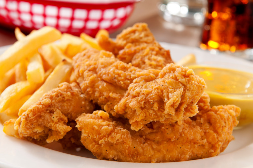 Chicken fingers with french fries and honey mustard and a cold soda.  Please see my portfolio for other food and drink images.