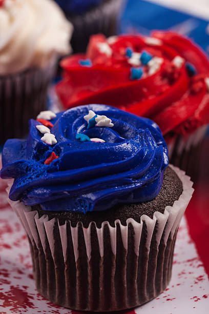 istock Close Up Selective Focus on Blue Patriotic Cupcake in Foreground 452721405