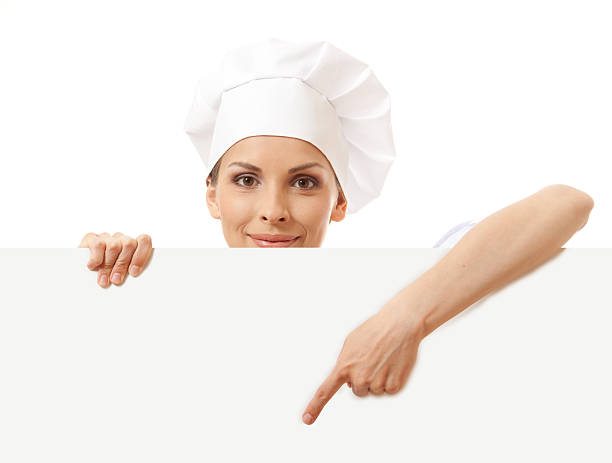 istock Chef woman with blank board in front of her 452724979