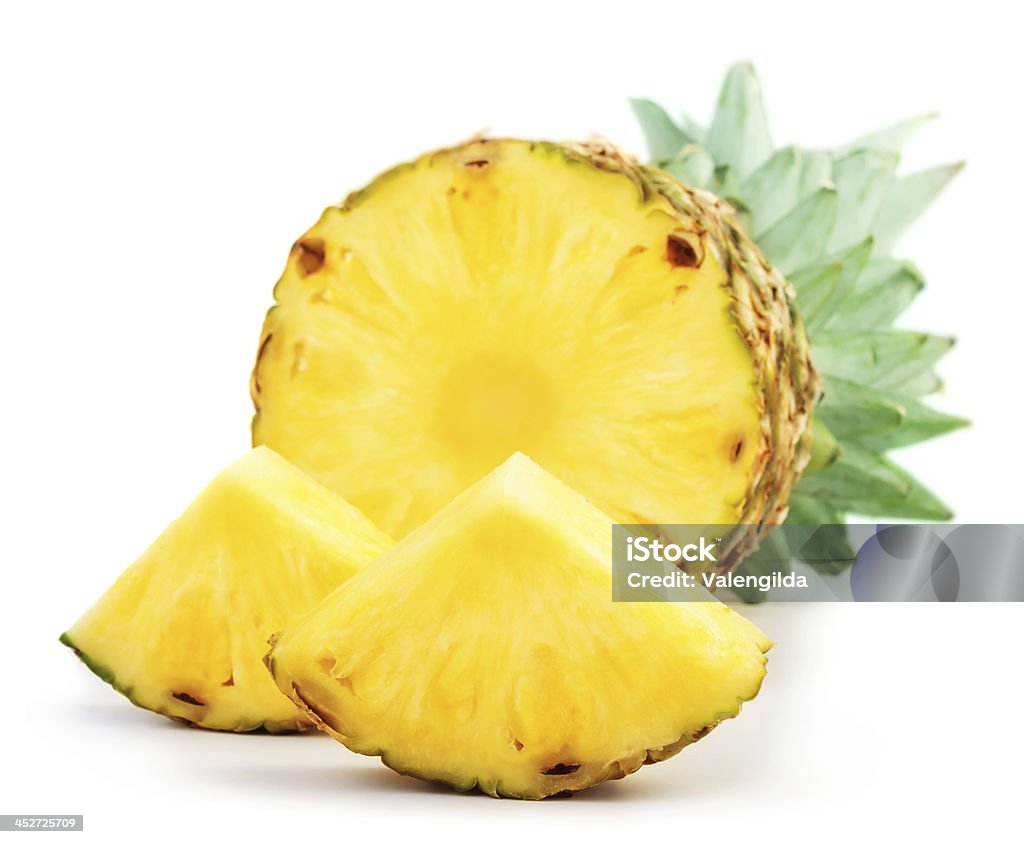 Pineapple with slices Pineapple with slices isolated on white Pineapple Stock Photo