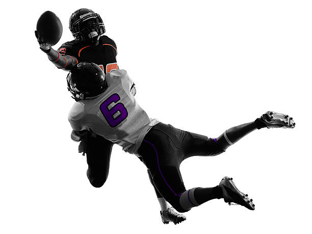 two american football players tackle silhouette two american football players tackle in silhouette shadow on white background defending sport photos stock pictures, royalty-free photos & images