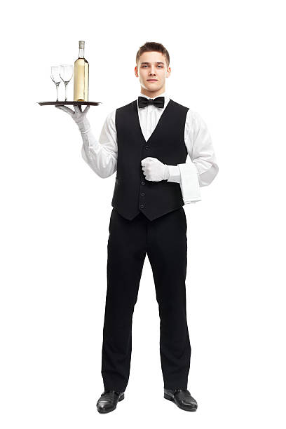 istock Young waiter with bottle of wine on tray 452729159