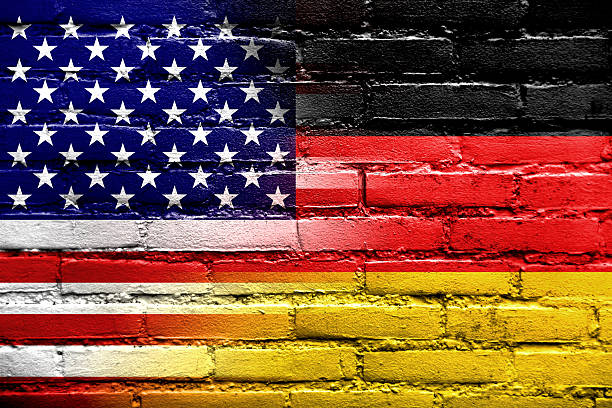 istock USA and Germany Flag painted on brick wall 452730611