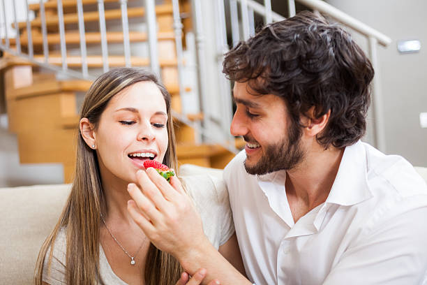 istock Couple eating strawberries 452738449