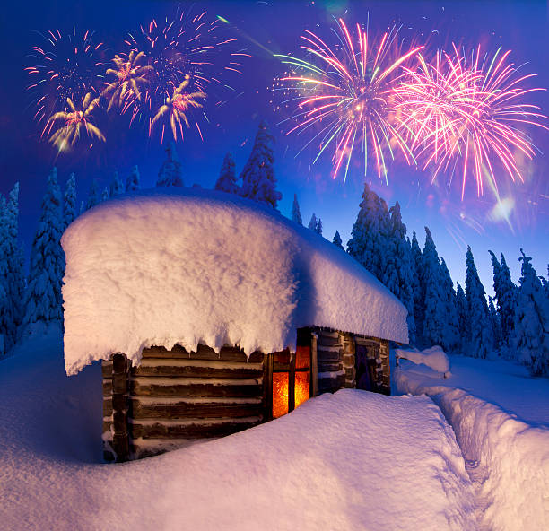 istock Alpine hut in a snowy forest with fireworks 452741427